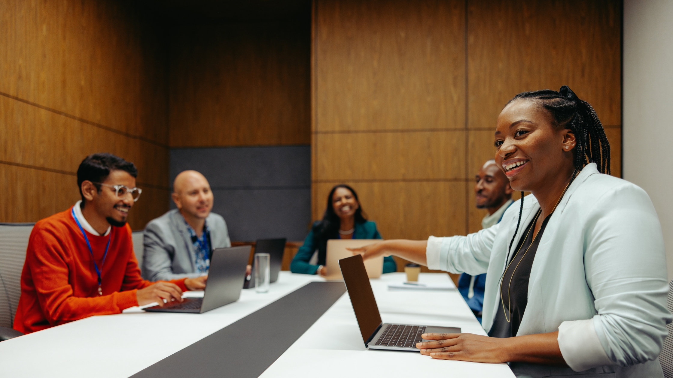 Corporate professionals having a meeting around a modern conference table